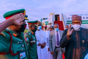 Buhari acknowledges salute