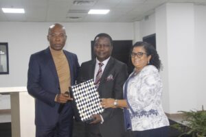 Olusiji and wife receiving a parting gift from Mr Ekeh 