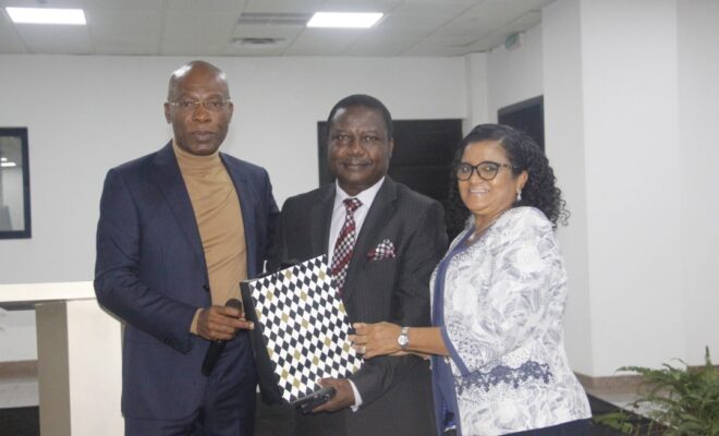 Olusiji and wife receiving a parting gift from Mr Ekeh