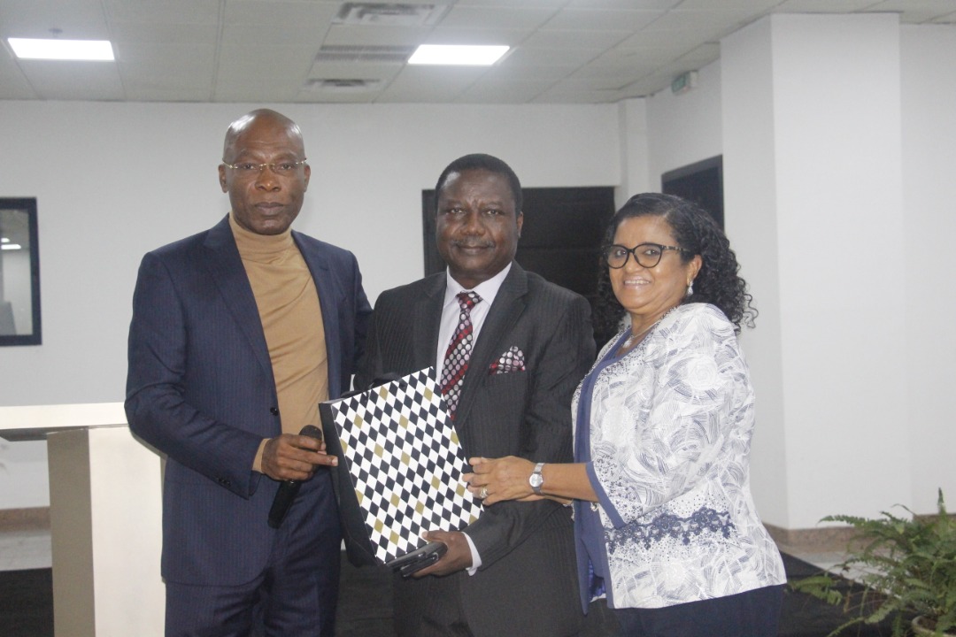 Olusiji and wife receiving a parting gift from Mr Ekeh