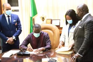 Okowa signing the 2022 Appropriation Bill into law