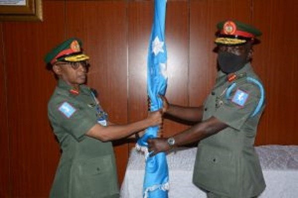 (L-R )The Outgone GOC 1 Division Nigeria Army Maj-Gen Kabir Muhktar, presenting symbol of the division Stallion Flag to new GOC Maj-Gen Taoreed Lagbaja on Monday in Kaduna.